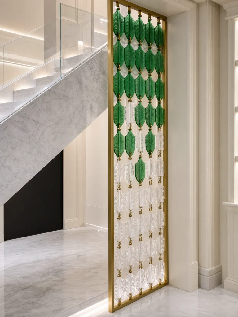 Green and clear leaf crystal hanging screen beside an interior staircase