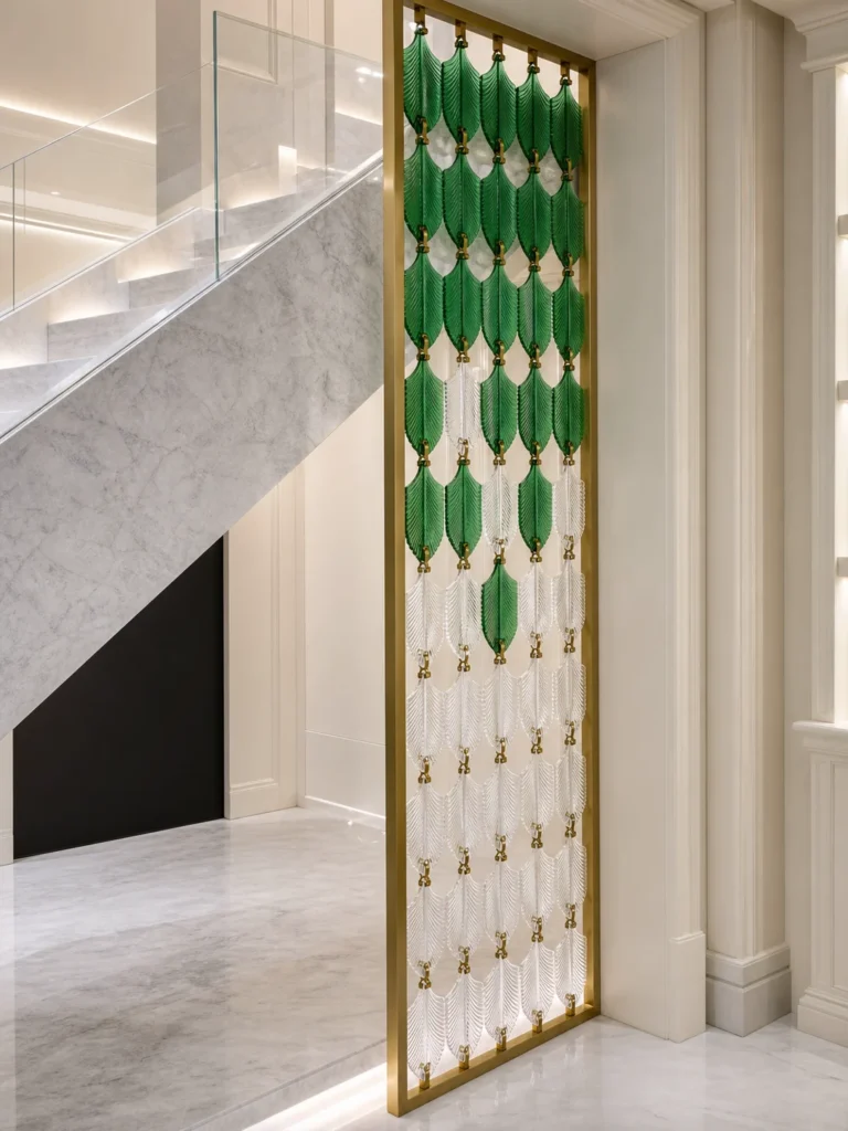 Green and clear leaf shaped crystal screen beside a staircase
